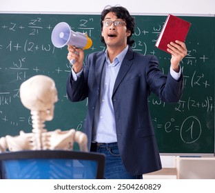 Young male math teacher and student skeleton - Powered by Shutterstock