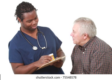 Young Male Nurse Talks About Medication With An Older Patient