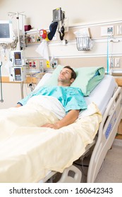 Young Male Patient Resting On Bed In Hospital