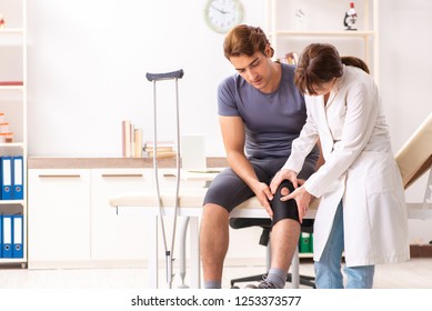 Young male patient visiting female doctor traumatologist  - Shutterstock ID 1253373577