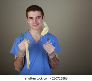 Young Male Phlebotomist With Equipment For Drawing Blood