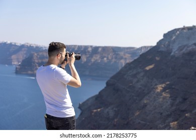 Young Male Photographer In Santorini, Greece.