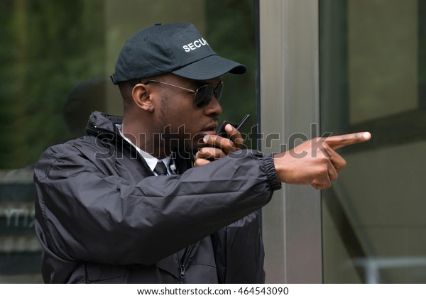 Young Male Security Guard Gesturing While Stock Photo (Edit Now) 464543090