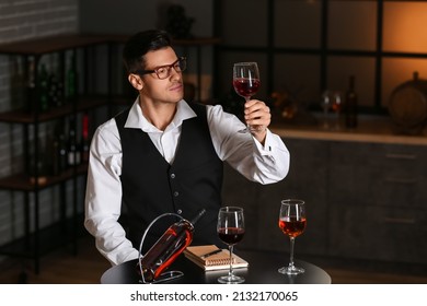 Young Male Sommelier Tasting Types Of Wine