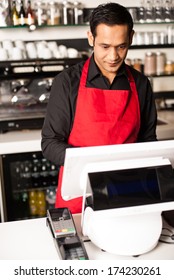 Young Male Staff At The Cash Counter