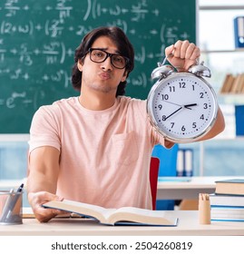 Young male student in the classroom