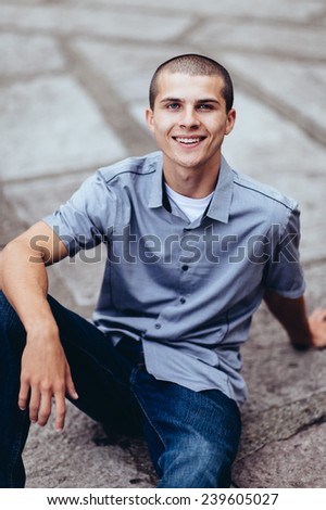 Similar – Image, Stock Photo Stylish teenager sitting on a wooden bench