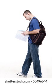 Young Male Student Walking To School And Studying