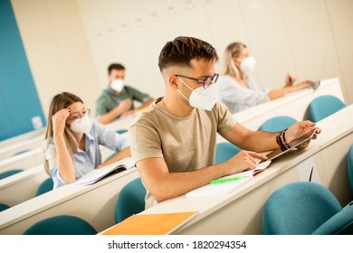 Young Male Student Wearing Face Protective Medical Mask For Virus Protection At Lecture Hall