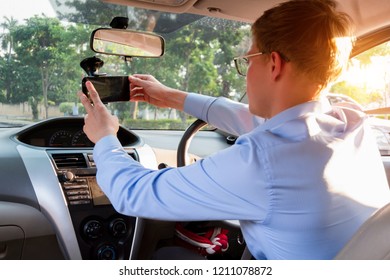 young male taxi driver use applications map in mobile phone, taxi driver concept