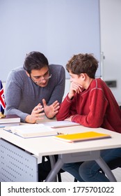 Young Male Teacher And Schoolboy In The Classroom