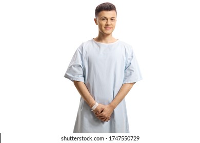 Young Male Teenage Patient In A Hospital Gown Isolated On White Background