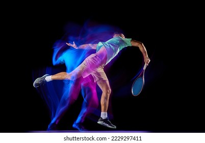 Young male tennis player in t-shirt and shorts playing tennis isolated over dark background in mixed purple neon light. Concept of motion, speed, professional sport. - Powered by Shutterstock