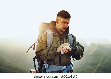 Young Male Traveler Looking At His Smart Watch