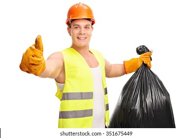 Young male waste collector holding a trash bag and giving a thumb up isolated on white background