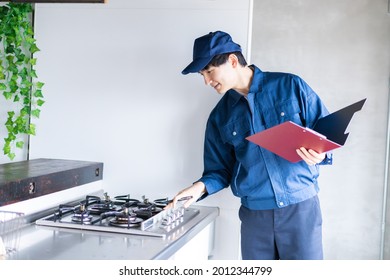 Young male worker checking gas - Powered by Shutterstock