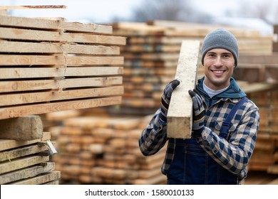 Young male worker in timber warehouse  - Shutterstock ID 1580010133