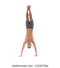Young man acrobatics gymnastic doing a handstand studio isolated on white background, athletic sportsman