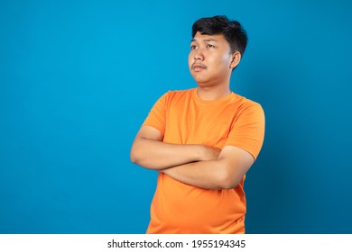 Young Man Acting Silly On Blue Background