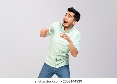 young man is afraid of fear , scared in casual clothes , wearing white shirt negative emotion ,isolated on white background