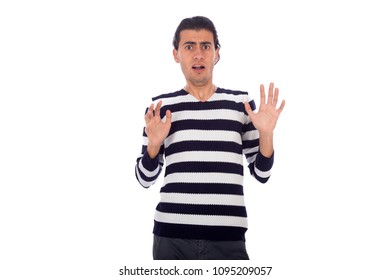 young man afraid and stepping back from something , isolated on white background