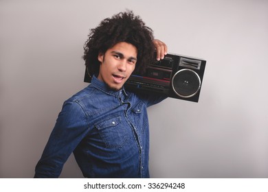 Young Man With Afro Hold Old Tape Recorder