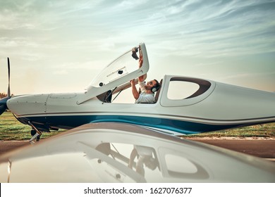 Young man aircraft pilot of light aircraft. Ready to fly. Copyspace - Powered by Shutterstock