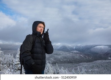 Young Man Alone on top of Mountain during Winter - Powered by Shutterstock