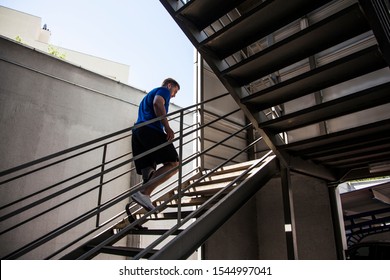 young man and amputee athlete, testing his new prosthesis by climbing stairs - Powered by Shutterstock