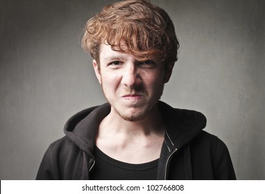 Young man with angry expression