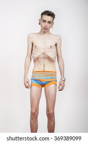 Young Man With Anorexia Nervosa Problem. White Background.