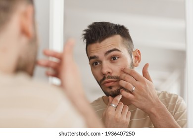 Young Man Applying Face Cream