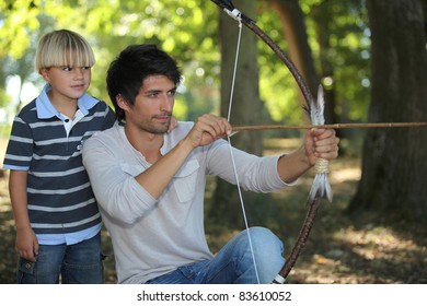 Young Man With Archer And Kid