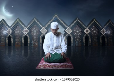 Young Man Asian Moslem Pray On The Night With Mosque And Moon Background