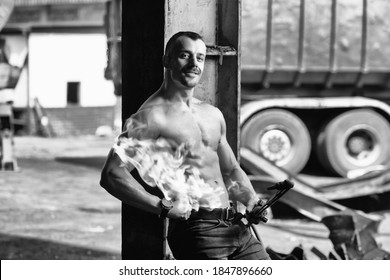 Young Man Athlete Welder is Holds the Gas Torch in His Hand the Fire and the Flame Burns From the Nozzle - Powered by Shutterstock