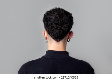 Young man from back with curly taper fade haircut. - Powered by Shutterstock