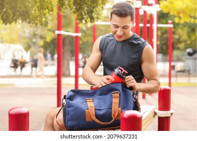 Young Man With Bag On Sport Ground