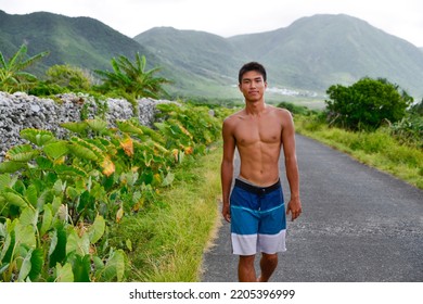 Young Man Bare-chested Man Walking On The Beach Barefoot. Scenic Ocean View, Morning Photo,