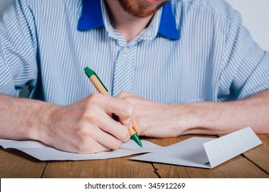 Young Man With Beard Writing Letter