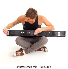 Young Man With Black Case On Guitar