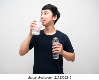 Young Man Black Shirt Drinking Water And Holding Water Bottle Portrait