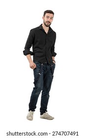 Young Man In Black Shirt With Rolled Up Sleeves Walking. Full Body Length Portrait Isolated Over White Background.