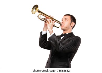 A young man in black suit playing a trumpet isolated on white background
