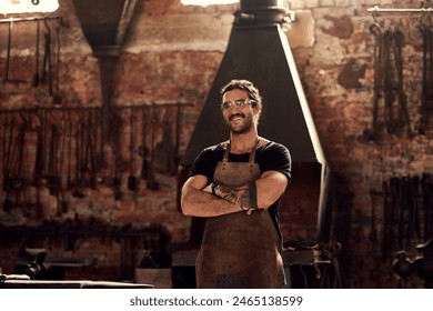 Young man, blacksmith and metal with confidence in workshop for steel, welding or crafting. Male person, welder or crafter with smile, arms crossed or profession for manufacturing at factory or forge - Powered by Shutterstock