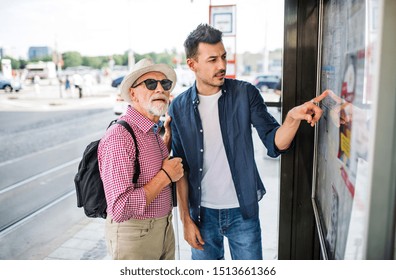 Young man and blind senior with white cane at bus stop in city. - Powered by Shutterstock