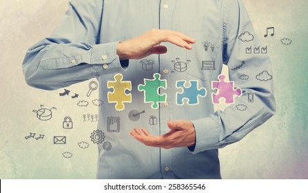 Young man in blue shirt holding business creativity concepts - Powered by Shutterstock