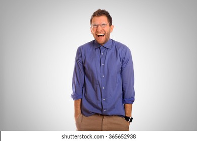 Young man in a blue shirt smiling fun - Shutterstock ID 365652938