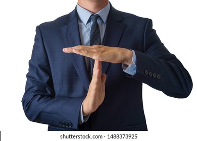 Young man in a blue suit holds hands in a timeout sign, isolate on a white background