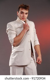 Young Man In Blue Tanktop Pose On Pink Background