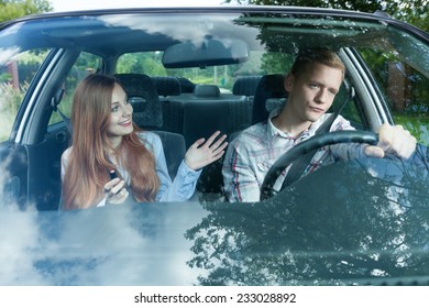 Young Man Bored With His Female Passenger